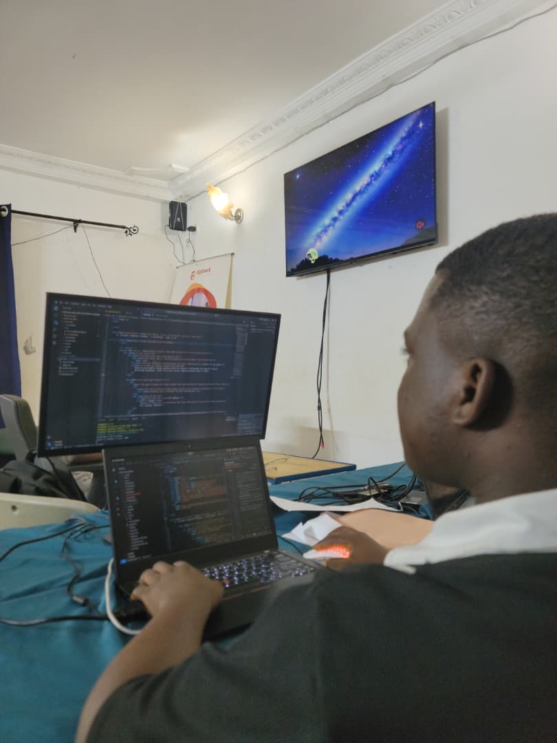Professional working on a laptop in a modern office environment